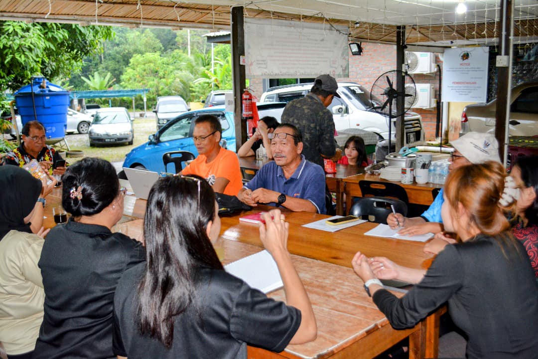 May be an image of 7 people, people studying, table and text