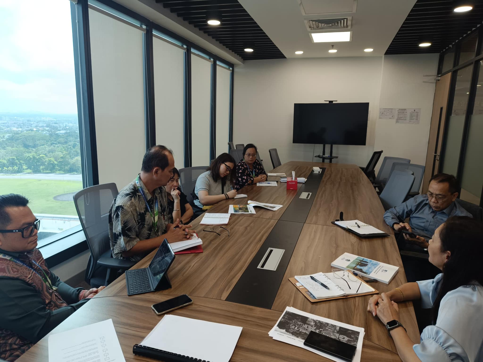 May be an image of 6 people, people studying, table and text