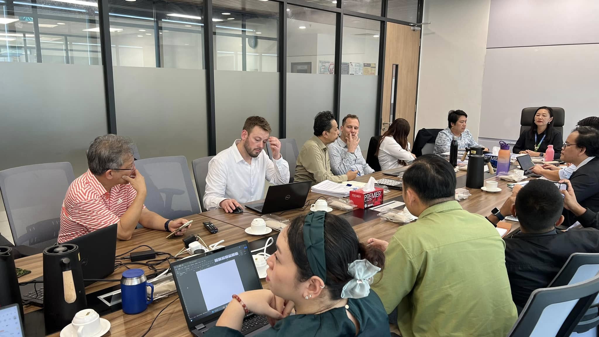May be an image of 11 people, people studying and table